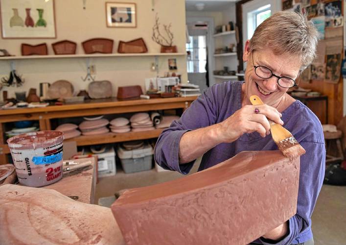 Shelburne Falls potter Mary Barringer, seen in her studio, is one of the eight host artists for this year’s Asparagus Valley Pottery Trail April 27-28. She’s hosting three guest artists, including two from Minnesota.