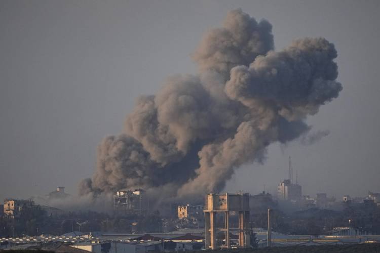 Smoke rises following an Israeli bombardment in the Gaza Strip, as seen from southern Israel , Wednesday, Dec. 6, 2023. (AP Photo/Ariel Schalit)