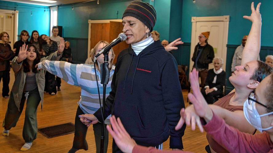 Young@Heart Chorus member Evelyn Harris takes the mic as members of Hatchery, teen dancers from Northampton’s School of Contemporary Dance & Thought, make their moves during a joint rehearsal of the groups at the Bombyx Center in Florence.