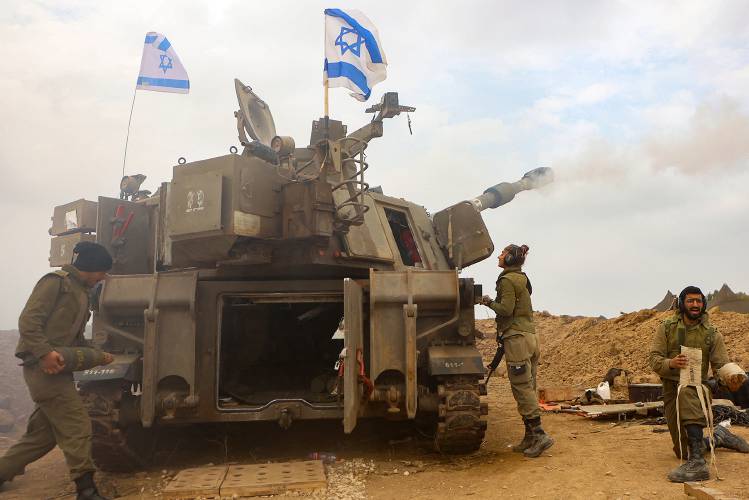 An Israeli artillery unit is pictured near the border with the Gaza Strip on Dec. 5, 2023, amid continuing battles between Israel and the militant group Hamas. (Gil Cohen-Magen/AFP via Getty Images/TNS)