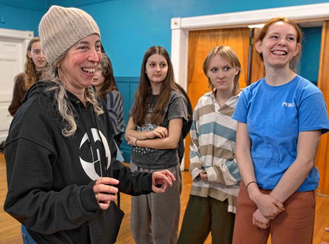 Jennifer Polins, artistic director of Hatchery, shares a laugh with some of the teen dancers at a recent rehearsal at the Bombyx Center in Florence.