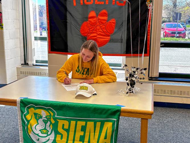 South Hadley’s Lauren Marjanski signs her National Letter of Intent to play soccer at Siena College on Monday in the library at South Hadley High School.