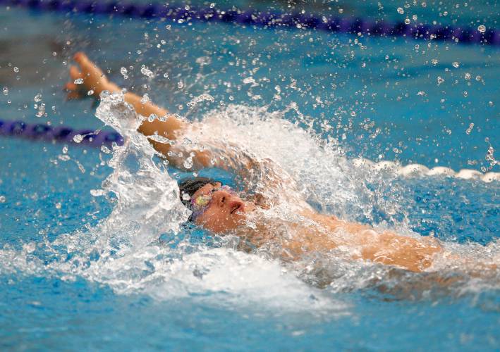 Belchertown’s Luke Giguere competes against Northampton in the 100-yard backstroke earlier this season at the Chestnut Hill Community School pool in Belchertown.