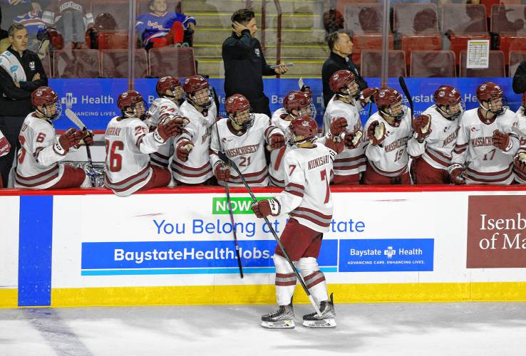 UMass celebrates after a goal by Samuli Niinisaari (7) against AIC in the first period earlier this season at the Mullins Center in Amherst.
