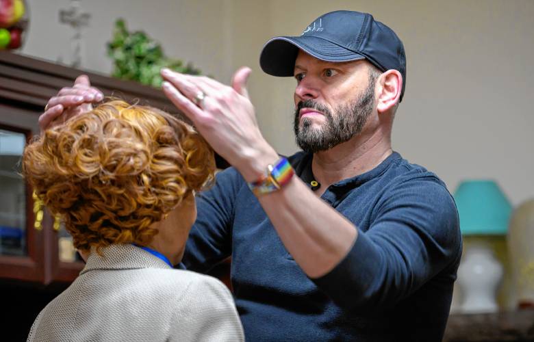 Wig and hair designer Jason P. Hayes adjusts a wig for Rona Leventhal during a rehearsal for Easthampton Theater Company’s “Torch Song.” Hayes, an in-demand designer for theater and television, is volunteering his time for the production.